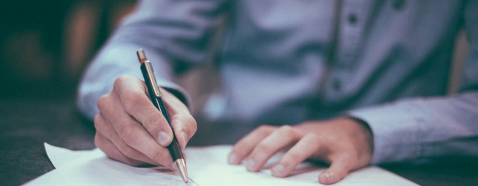 Print Solutions for Law Offices Man signing paper in law office