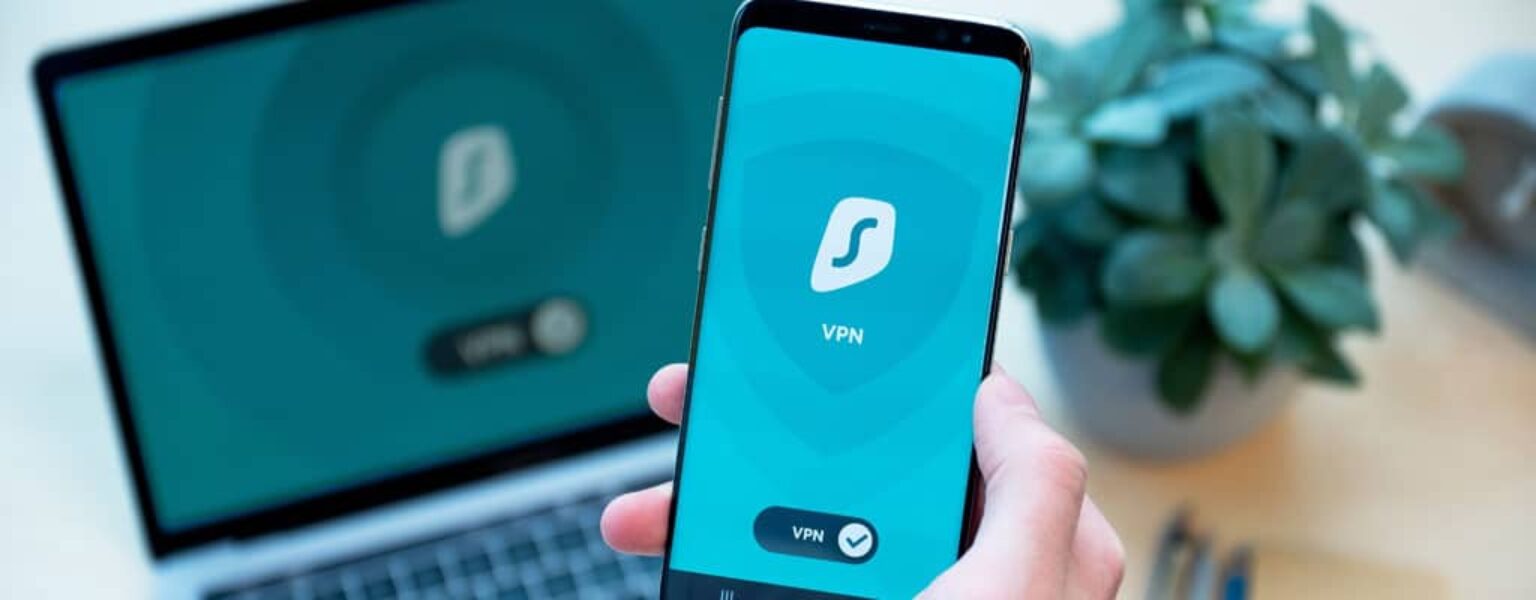 How to Improve Cybersecurity Phone and computer being used to explain how to improve cybersecurity