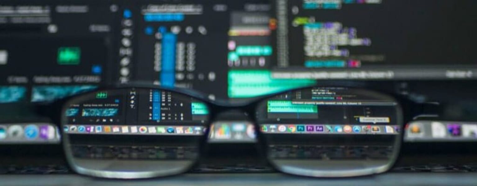 IT Infrastructure Support Computer monitor and glasses showing IT infrastructure support professionals