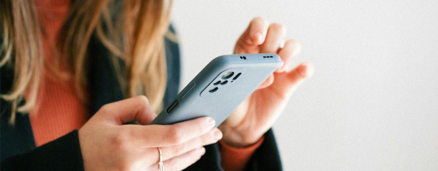 Digital Distribution Woman holding phone for digital distribution