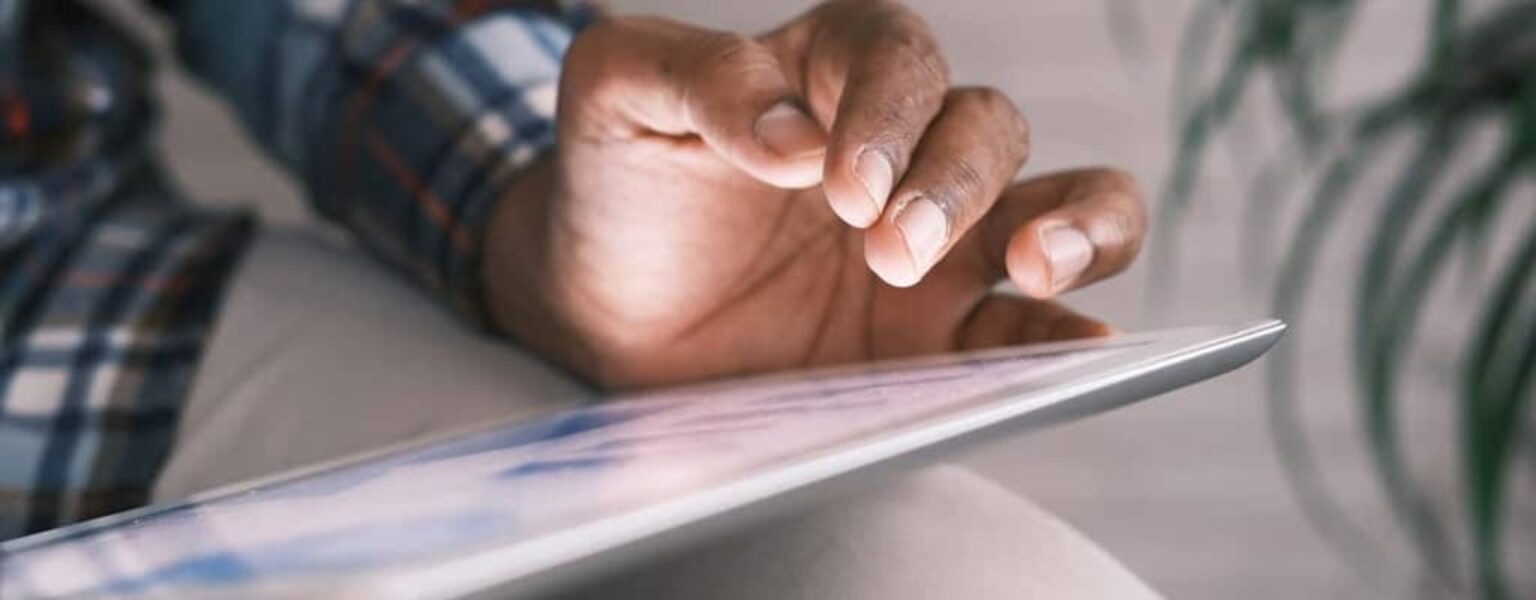 Cloud Based Document Management System Man using a cloud based document management system on an iPad