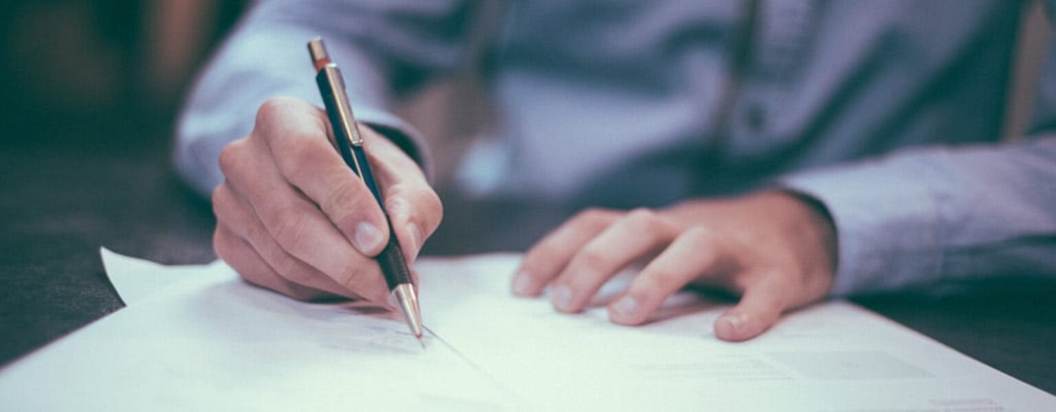 Man signing contract