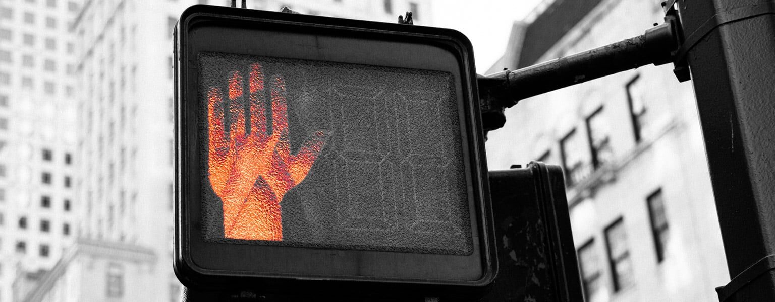 Do not walk sign representing zero trust and AI security