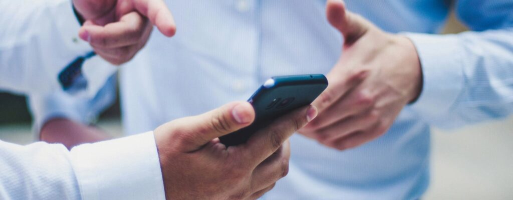 Men looking at mobile printing solutions