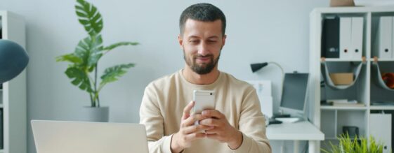 VoIP Call Features Man in an office on phone using VoIP call features