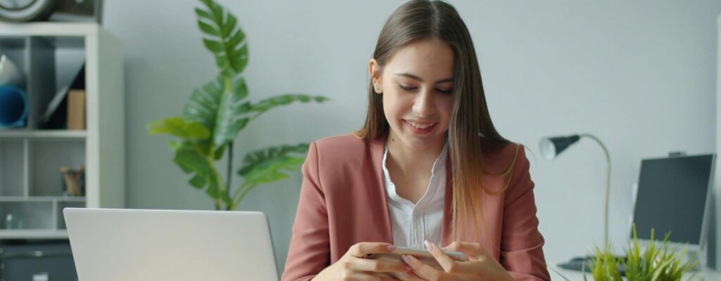 A woman on her cell phone while at work