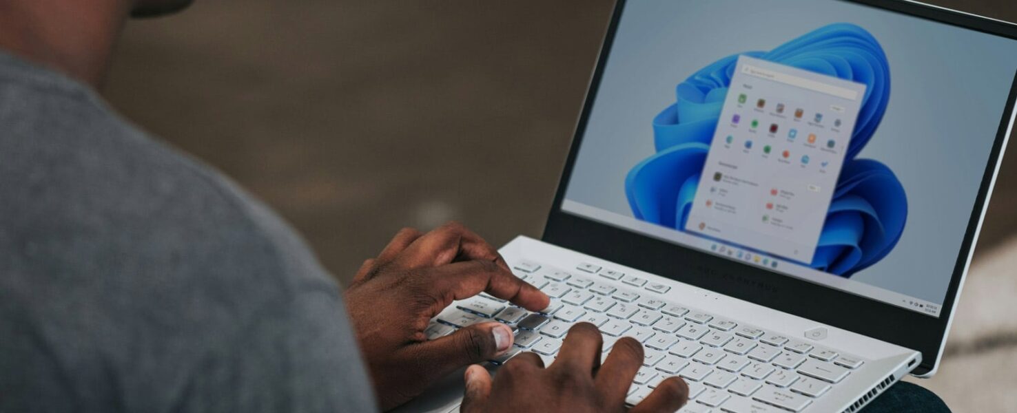 A man using a Windows laptop